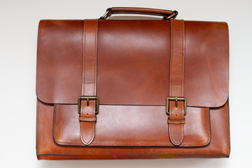 brown classic briefcase made of genuine leather on a white background