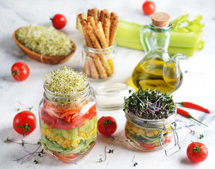 Vegan salad in with microgreens in a jar