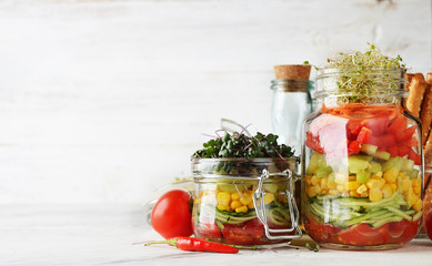 Fototapeta na wymiar Vegan salad in with microgreens in a jar