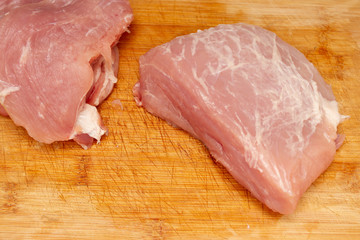fresh pork fillet on a wooden board