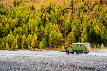 ZIL-131 off-road truck driving off-road. Aktru River Valley, Altai Mountains, Russia