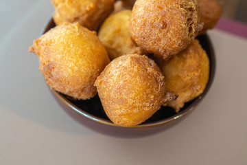 Bowl full of Nigerian buns ready to eat