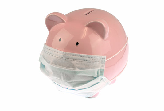 Pink piggy bank with mask isolated on white background
