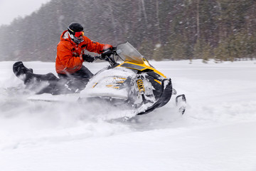 Athlete on a snowmobile.