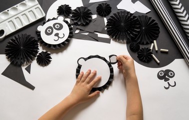 Panda made of paper. Material and tool for creativity.
