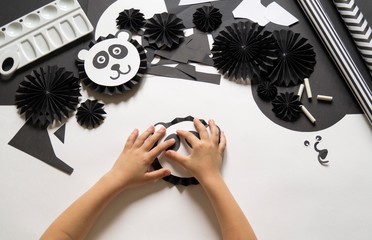 Panda made of paper. Material and tool for creativity.