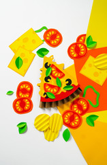Pizza made of paper. Fast food.