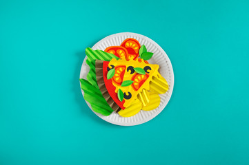 Pizza made of paper. Fast food.