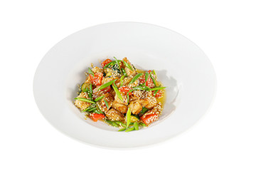 Potatoes with meat, chicken, pork, zucchini, tomato, sesame seeds and green onions, with teriyaki sauce, fried, baked portion on plate, on a wooden board on a white background Side view. For the menu