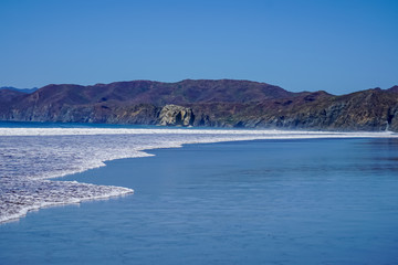 Beautiful aerial view of a sunset in  Naranjo Beach - Witch Rock Costa Rica