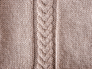 mocha knitted braid on knit cloth sweater as background