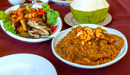 Fried fish and sauce sweet taste sour , Crispy catfish salad with green mango, Delicious food to eat with sticky rice in the country, Thailand