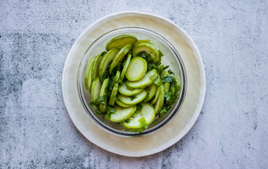 Green fresh zucchini slices salad. Vegan, vegetarian healthy food.