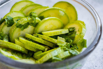 Green fresh zucchini slices salad. Vegan, vegetarian healthy food. Close up