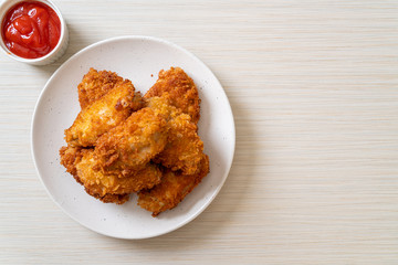 fried chicken wings with ketchup