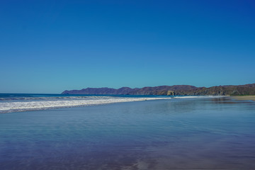 Beautiful aerial view of a sunset in  Naranjo Beach - Witch Rock Costa Rica