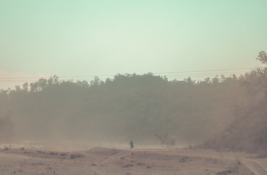 Man going somewhere in a dust storm