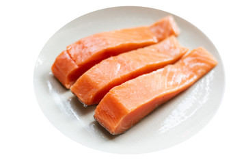 Fresh raw salmon steaks isolated on white background.