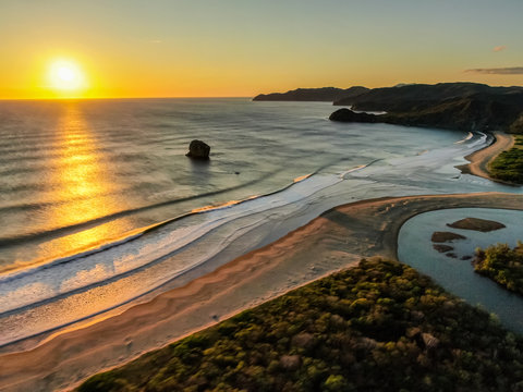 Beautiful aerial view of a sunset in  Naranjo Beach - Witch Rock Costa Rica