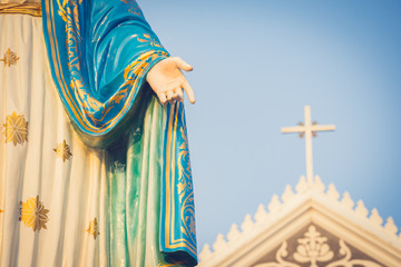 The blessed Virgin Mary statue figure. Catholic praying for our lady - The Virgin Mary. Blue sky...