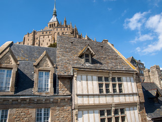 Fototapeta na wymiar Ancient buildings of the old town on the famous Mont Saint Michel island in France
