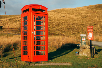 red telephone box in field