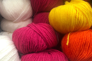 Wool clews colorful hobby background 