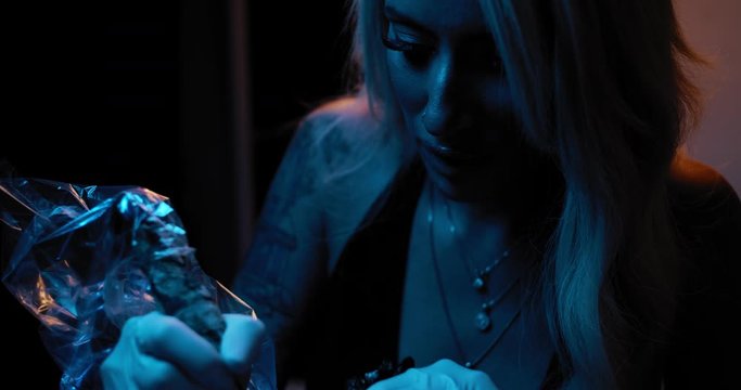 Close up of a young female tattoo artist working in her studio. BMPCC 4K