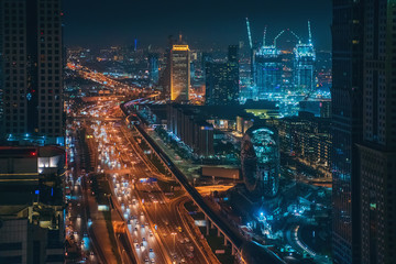 Panorama of Dubai downtown at night from above, United Arab Emirates.