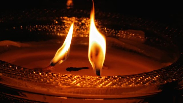 vigil lights at a cementary during night.