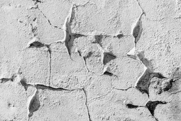 Abstract background from white concrete wall with peeled and cracked.