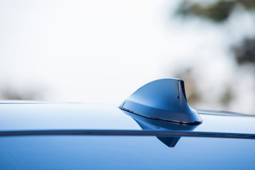Close-up GPS antenna shark fin shape on the luxury car roof,Car detail