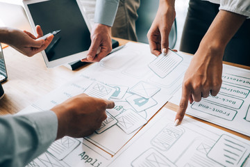 Business people analyzing investment graph meeting brainstorming and discussing plan in meeting...