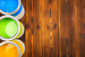House renovation, paint cans on the old wooden background with copy space - Image