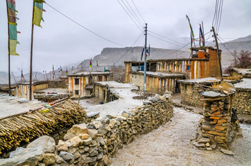 Old tibetan Chongur (Chongkar) village in Mustang in cloudy winter day. Kali Gandaki river valley,...