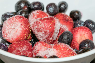 Frozen Berries - Strawberries & Blueberries Cold with Ice, Close up Macro