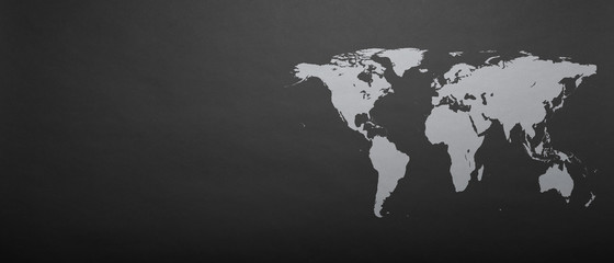 a world map on grey paper background