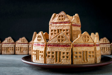 Sand cake in the form of an old fortress on a ceramic stand.