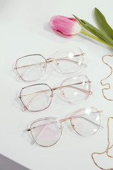 Stylish women's glasses. Glasses store advertising, eye health care.