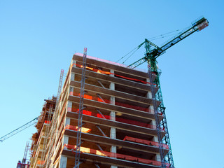 Construction site. Crane and building activity.