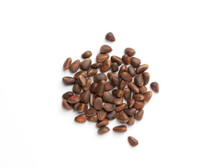 Naklejka premium Pine nuts in shells. Cedar pine nuts isolated on white background. 