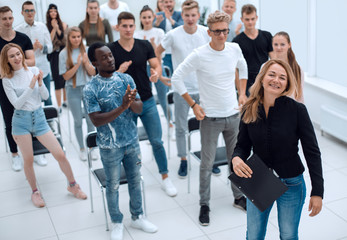 Fototapeta premium top view. a group of casual young people applauding together