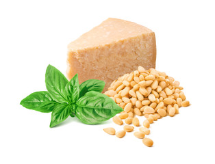 Chunk of parmesan cheese, green basil leaves and pine nuts isolated on white background. Italian...
