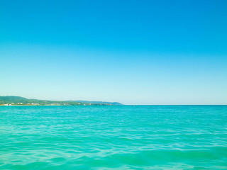 Fototapeta na wymiar Blue water of Tyrrhenian sea in Vada, Tuscany, Italy.
