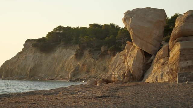 Big natural boulder on top of another at Fourni Beach, Rhodes Island, Greece