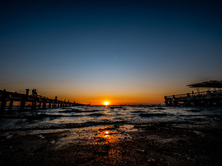 Naklejka na ściany i meble Photos of the sunset on the sea at Wonnapa Beach Thailand.