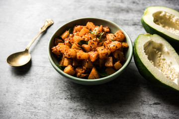 Kaccha Papita Sabji or Raw Papaya Sabzi, served in a karahi or bowl. selective focus