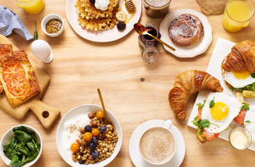 Overhead shot of brunch menu on wooden table with copy space.  Healthy sunday breakfast with...