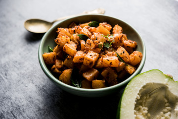Kaccha Papita Sabji or Raw Papaya Sabzi, served in a karahi or bowl. selective focus