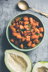 Kaccha Papita Sabji or Raw Papaya Sabzi, served in a karahi or bowl. selective focus